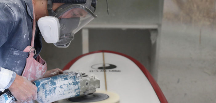 Blake Hansen shapes lives making surfboards Blake Hansen buffs out a board at the shop in Oceanside, California. (Timmy Heffernan)