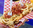 Rich bacon and onions embellishing fair food. (Michael Saechang/ Flickr)