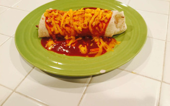 fresh carne burrito covered in cheddar cheese and enchilada sauce