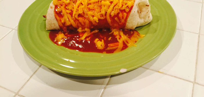 fresh carne burrito covered in cheddar cheese and enchilada sauce