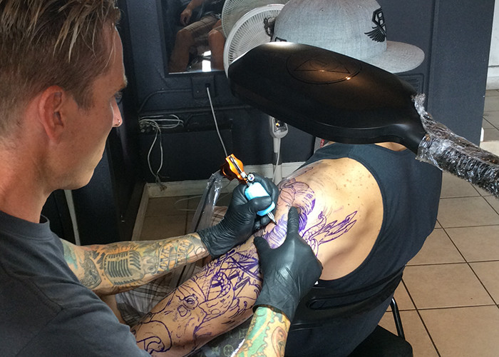 Here is a picture of Matt Tischler in San Clemente tattooing at the local Wild at Heart tattoo parlor.