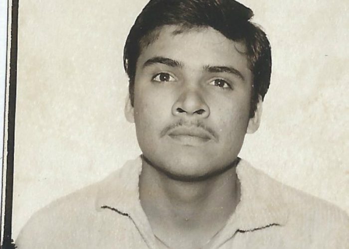My father's picture taken for his green card taken in 1985