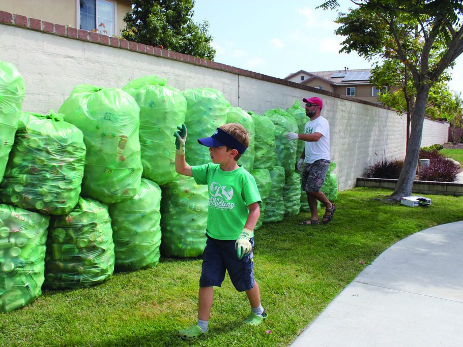 Hickman recounts the sorted materials before heading off to the recycling center. (Taya Buehler-Reagan)